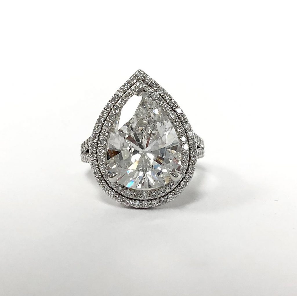 custom pear-shape diamond ring made with a recycled diamond